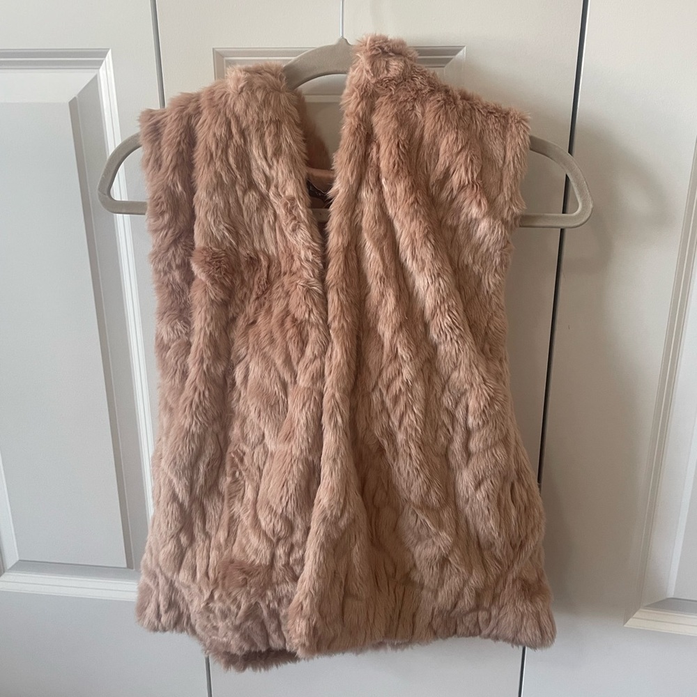 Light pink faux fur vest.
